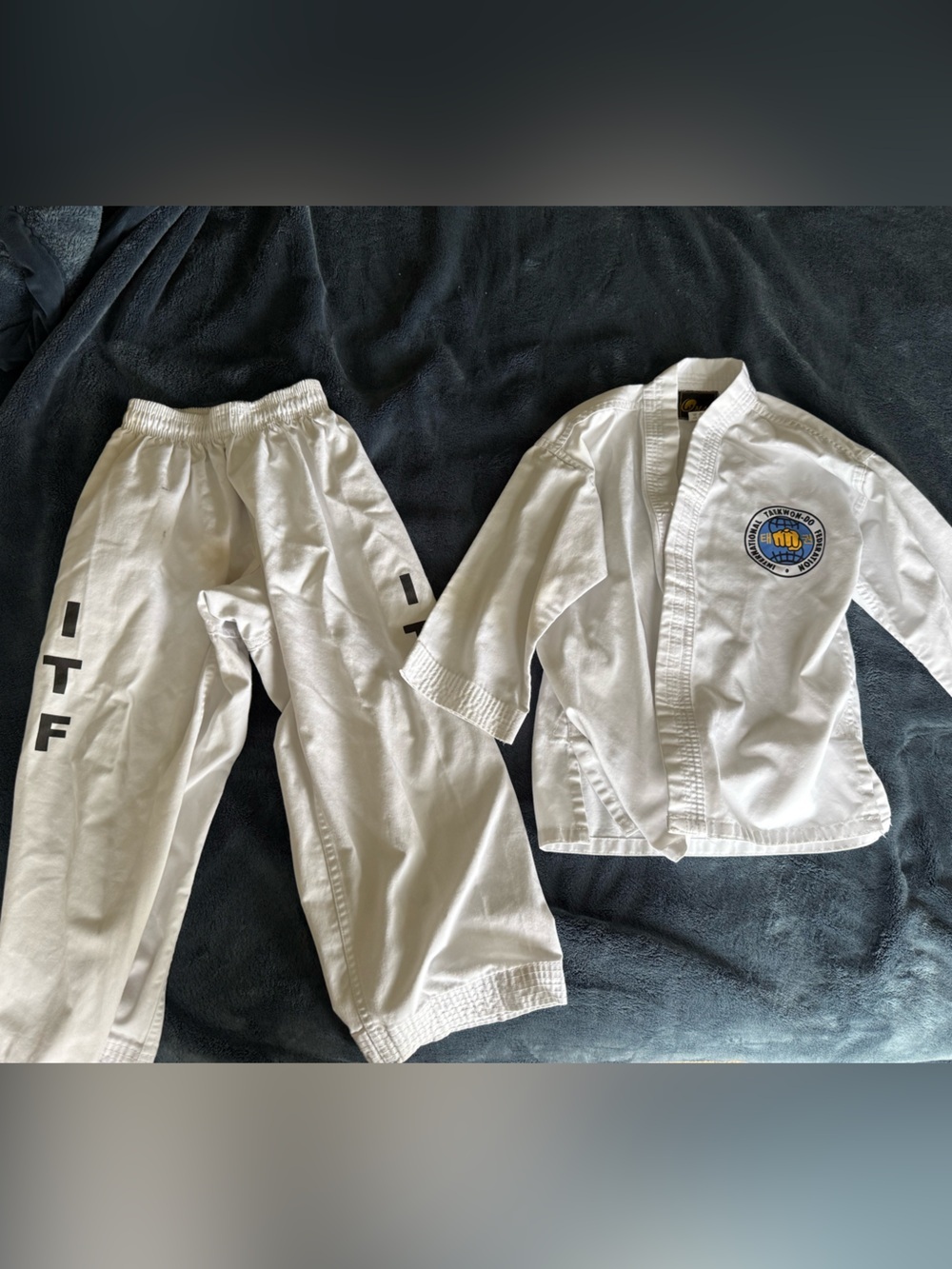Kids taekwondo outfit size 0 has some stains as pictured